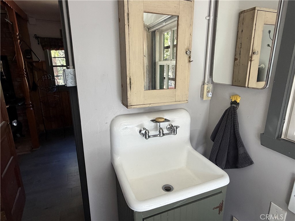 120 Barton Flats Road Angelus Oaks, CA 92305 - Photo 39 of 57 a bathroom with a sink and a mirror