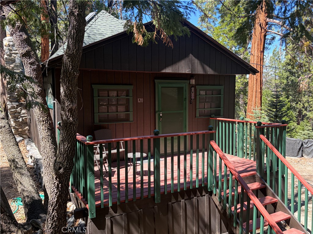 120 Barton Flats Road Angelus Oaks, CA 92305 - Photo 51 of 57 a view of a house with wooden deck and a large tree