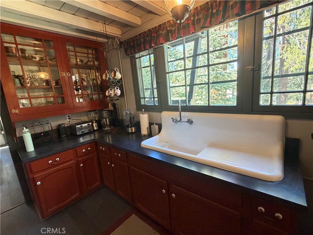 120 Barton Flats Road Angelus Oaks, CA 92305 - Photo 9 of 57 a spacious bathroom with a sink and a large mirror
