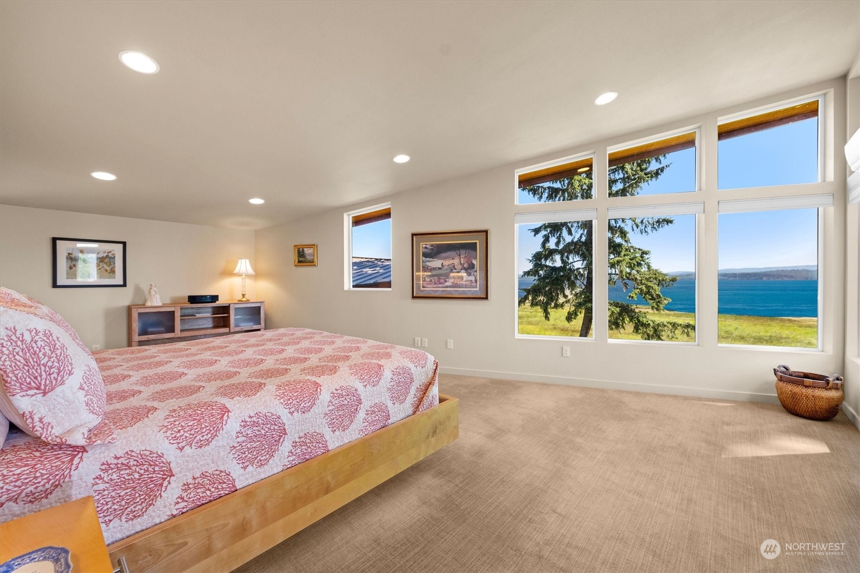 15550 Sandridge Road Long Beach, WA 98631 - Photo 18 of 36 a spacious bedroom with a bed and a large window