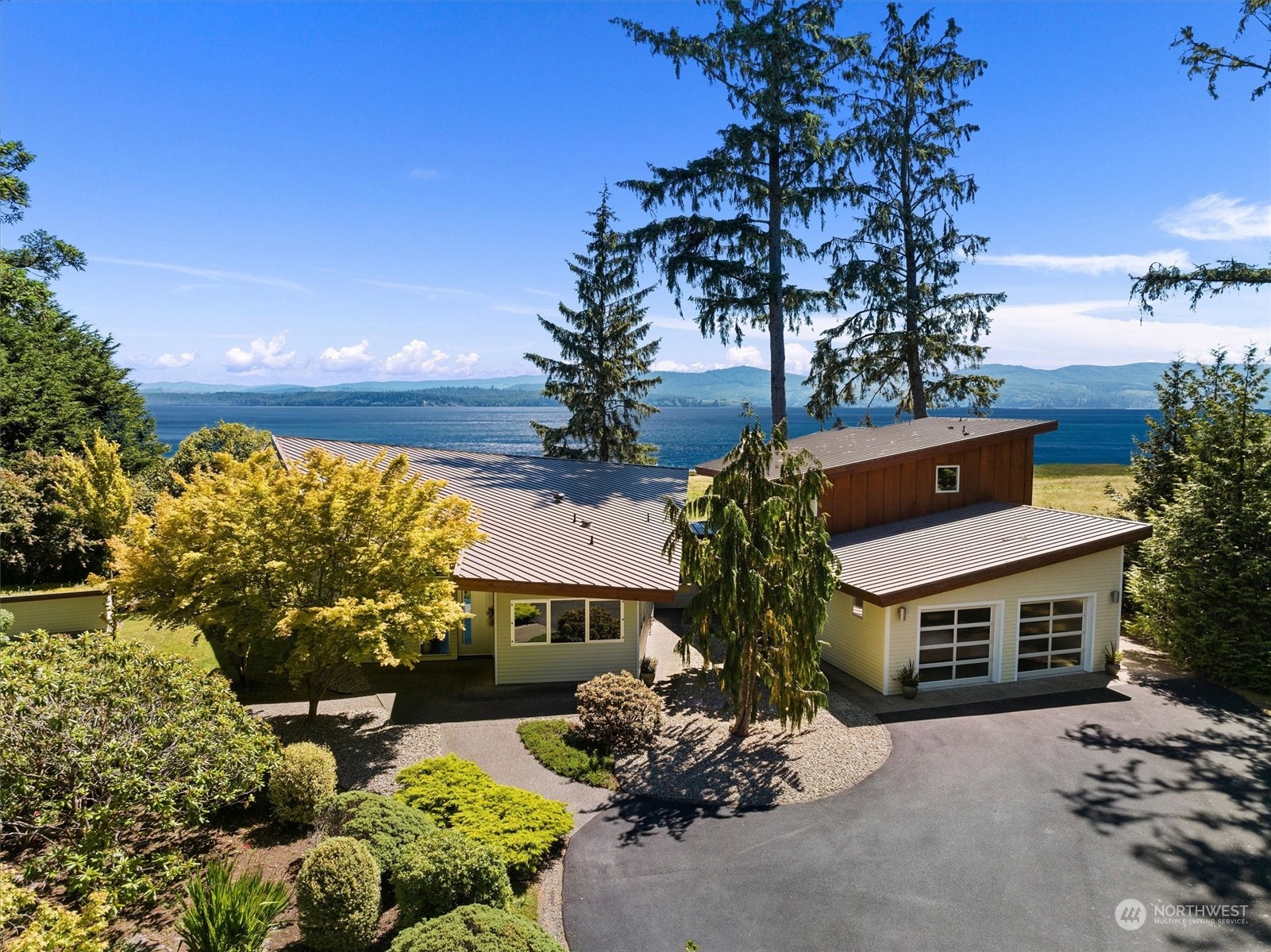 15550 Sandridge Road Long Beach, WA 98631 - Photo 2 of 36 a house with lots of trees