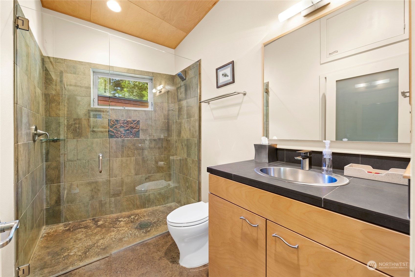 15550 Sandridge Road Long Beach, WA 98631 - Photo 25 of 36 a bathroom with a granite countertop sink a toilet and shower