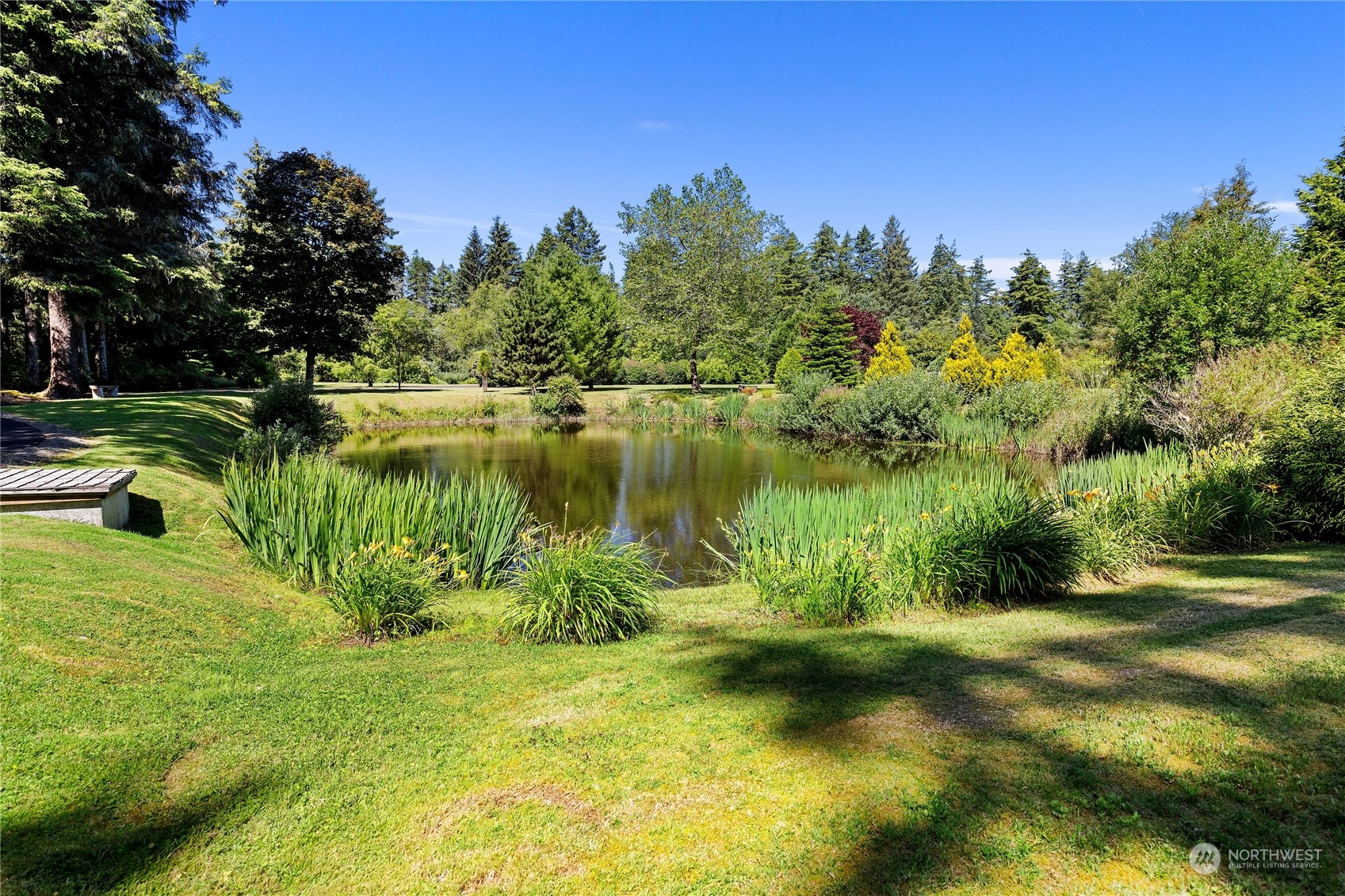 15550 Sandridge Road Long Beach, WA 98631 - Photo 30 of 36 a view of a lake with a yard
