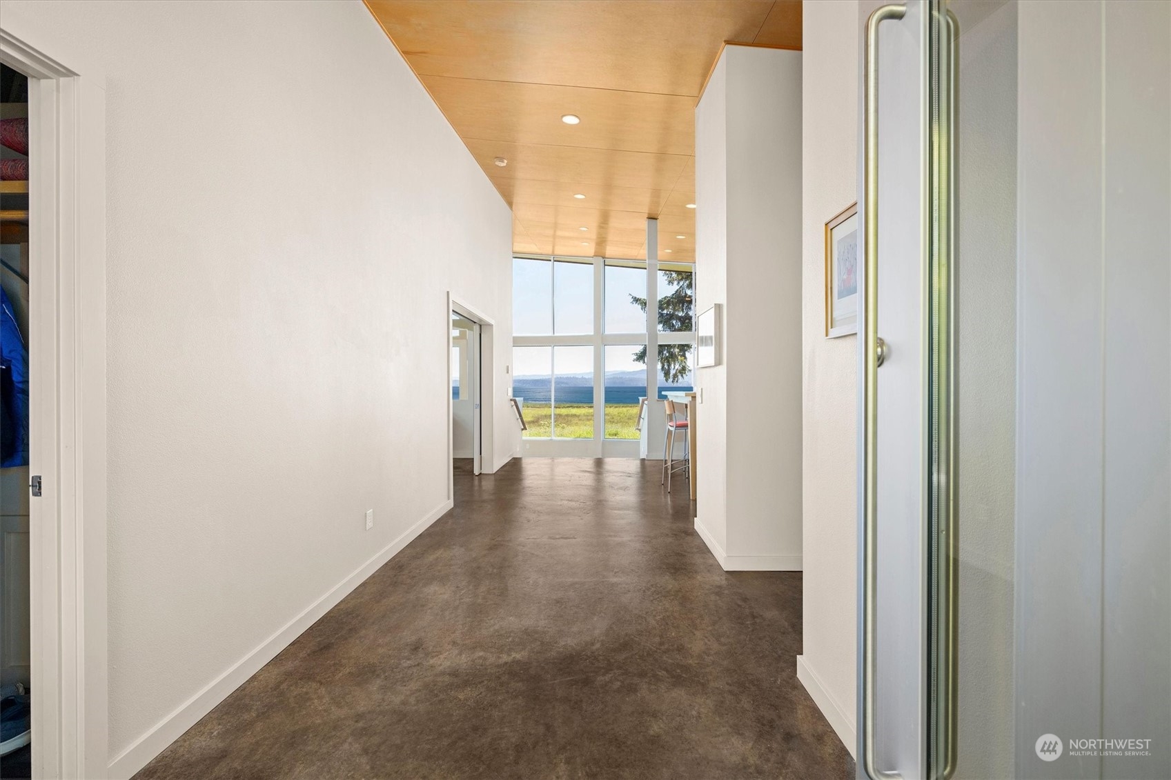 15550 Sandridge Road Long Beach, WA 98631 - Photo 3 of 36 a view of a hallway with wooden floor