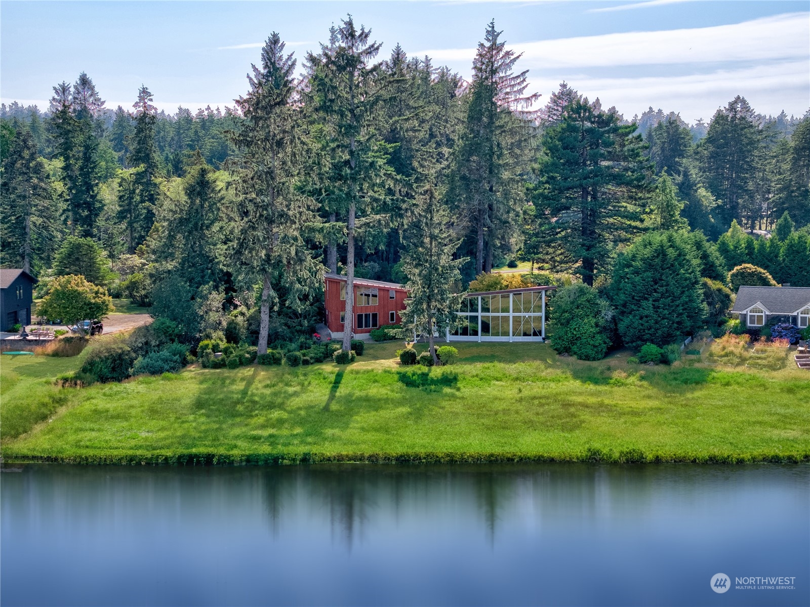15550 Sandridge Road Long Beach, WA 98631 - Photo 31 of 36 a backyard of a house with yard and lake view