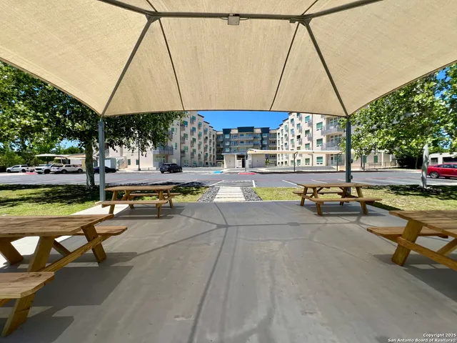 a view of swimming pool with sitting area