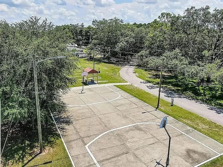3000 Clarcona Road, Unit 401 Apopka, FL 32703 - Photo 13 of 15 a view of a swimming pool with a seating space