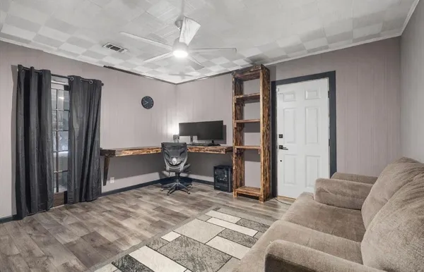 a bedroom with furniture a bed and a television
