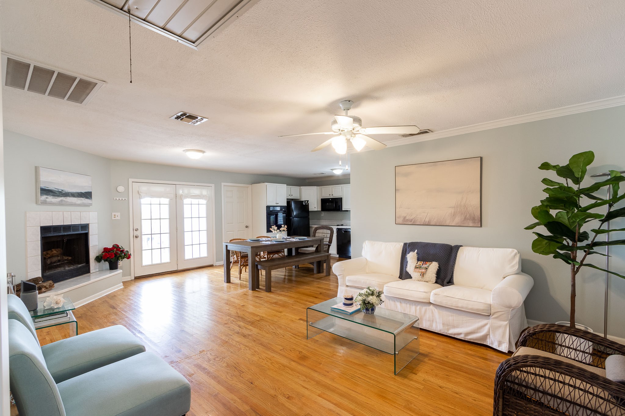 16721 Edward Teach Road Jamaica Beach, TX 77554 - Photo 4 of 49 HARDWOOD FLOORS THROUGHOUT Gives this property a warm and cozy vibe. Wood burning fireplace adds to the ambiance.