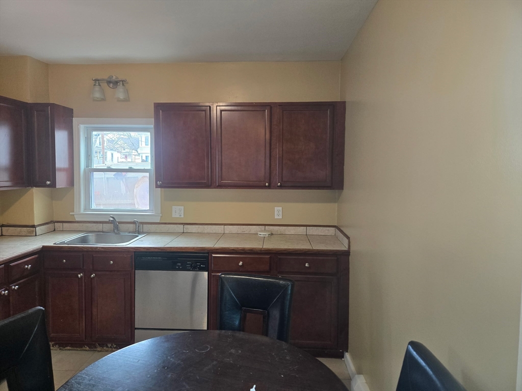 53 Groveland Street Lynn, MA 01902 - Photo 14 of 28 a kitchen with a sink and cabinets