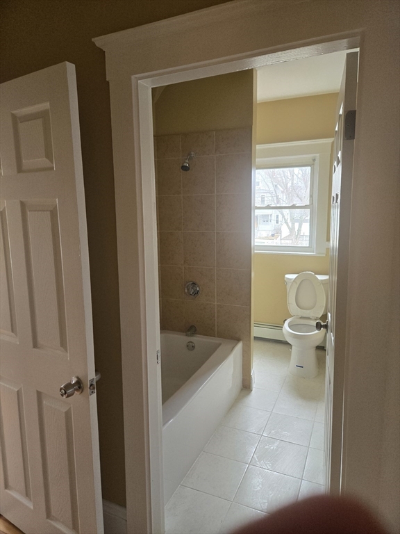 53 Groveland Street Lynn, MA 01902 - Photo 20 of 28 a bathroom with a bathtub and toilet