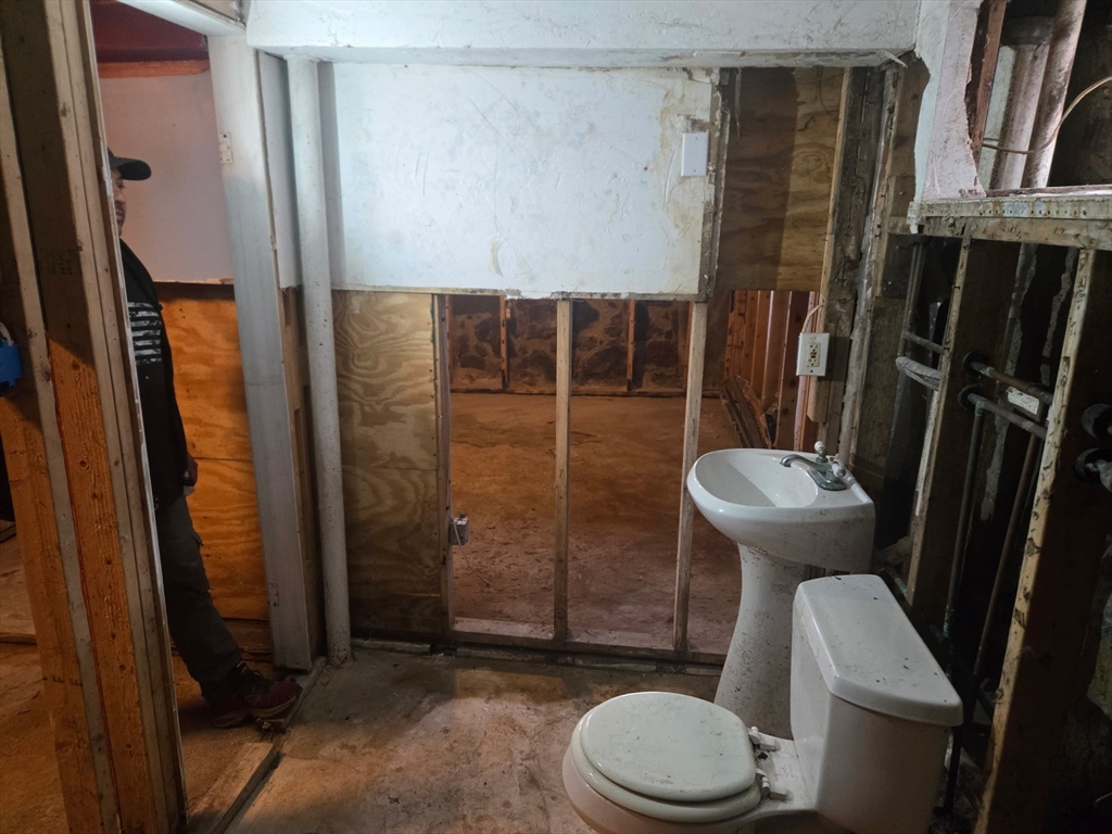 53 Groveland Street Lynn, MA 01902 - Photo 23 of 28 a bathroom with a toilet and a shower