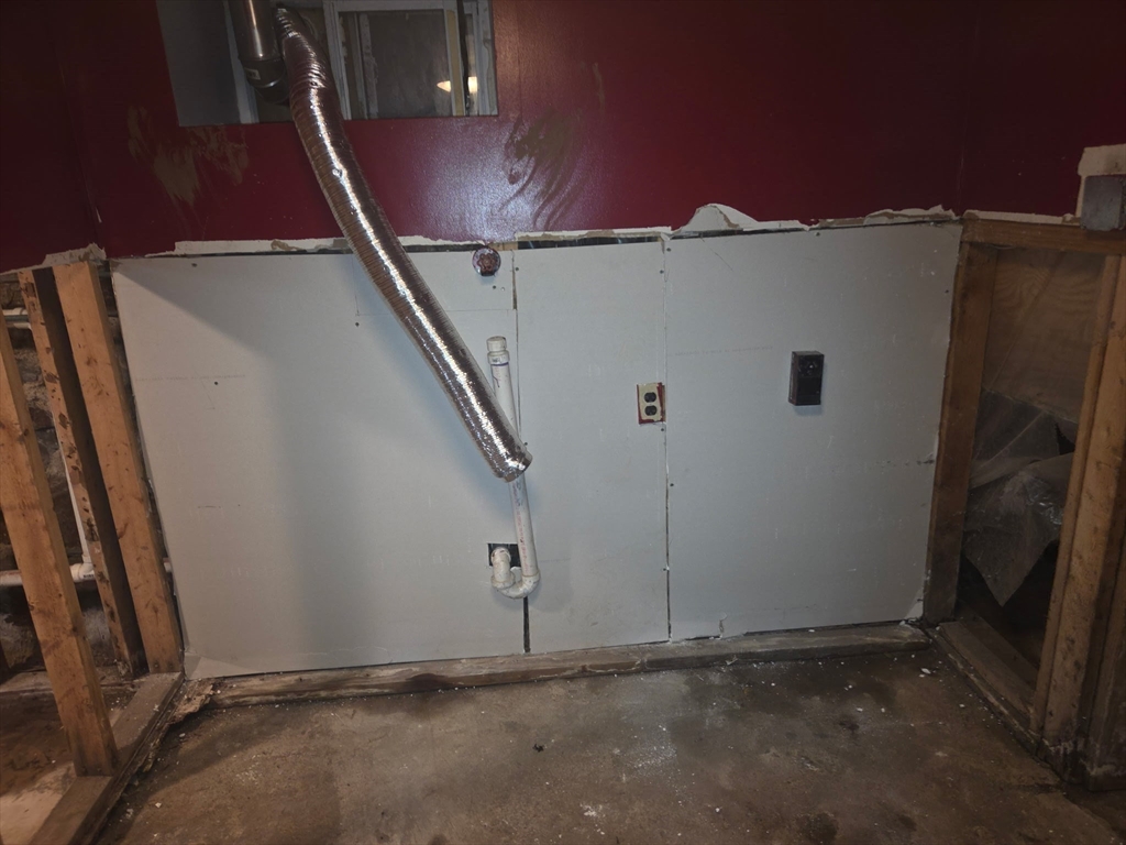53 Groveland Street Lynn, MA 01902 - Photo 25 of 28 an empty room with staircase