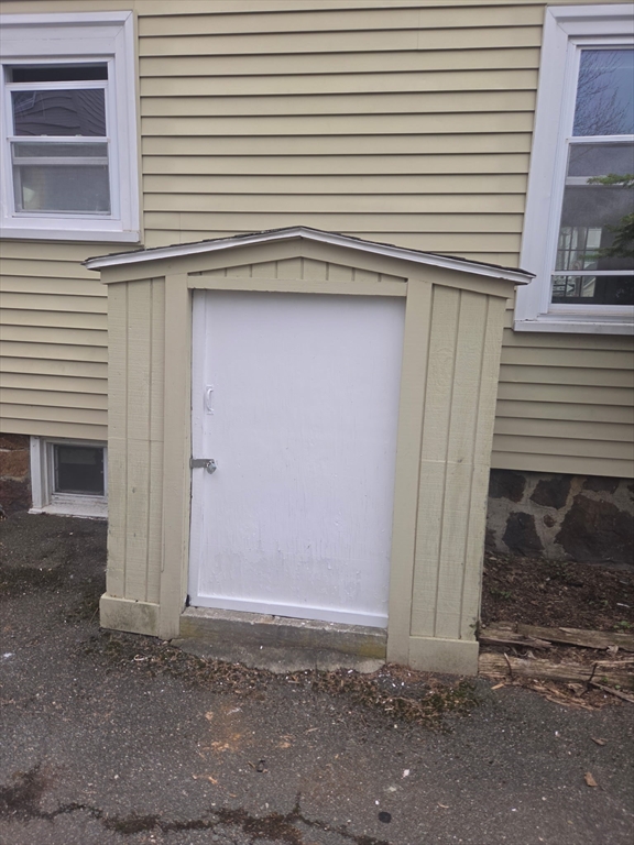 53 Groveland Street Lynn, MA 01902 - Photo 6 of 28 a view of a house with a door