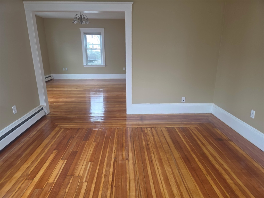 53 Groveland Street Lynn, MA 01902 - Photo 8 of 28 a view of empty room with wooden floor