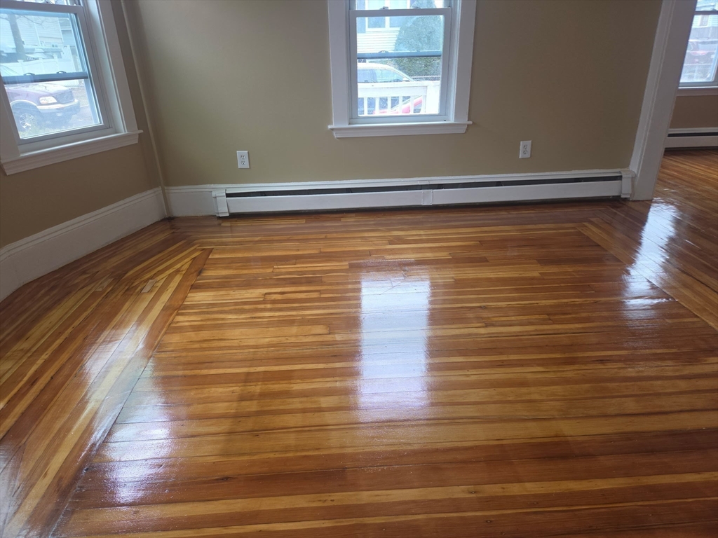53 Groveland Street Lynn, MA 01902 - Photo 9 of 28 a view of room with window and wooden floor