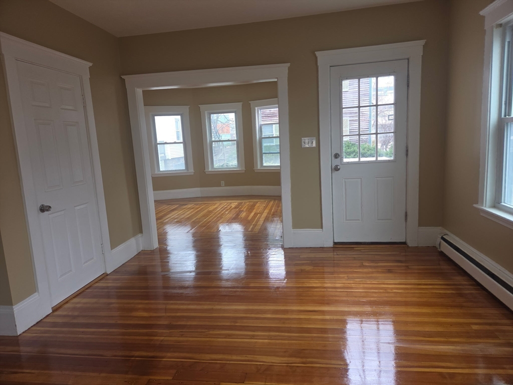 53 Groveland Street Lynn, MA 01902 - Photo 10 of 28 a view of empty room with wooden floor and fan