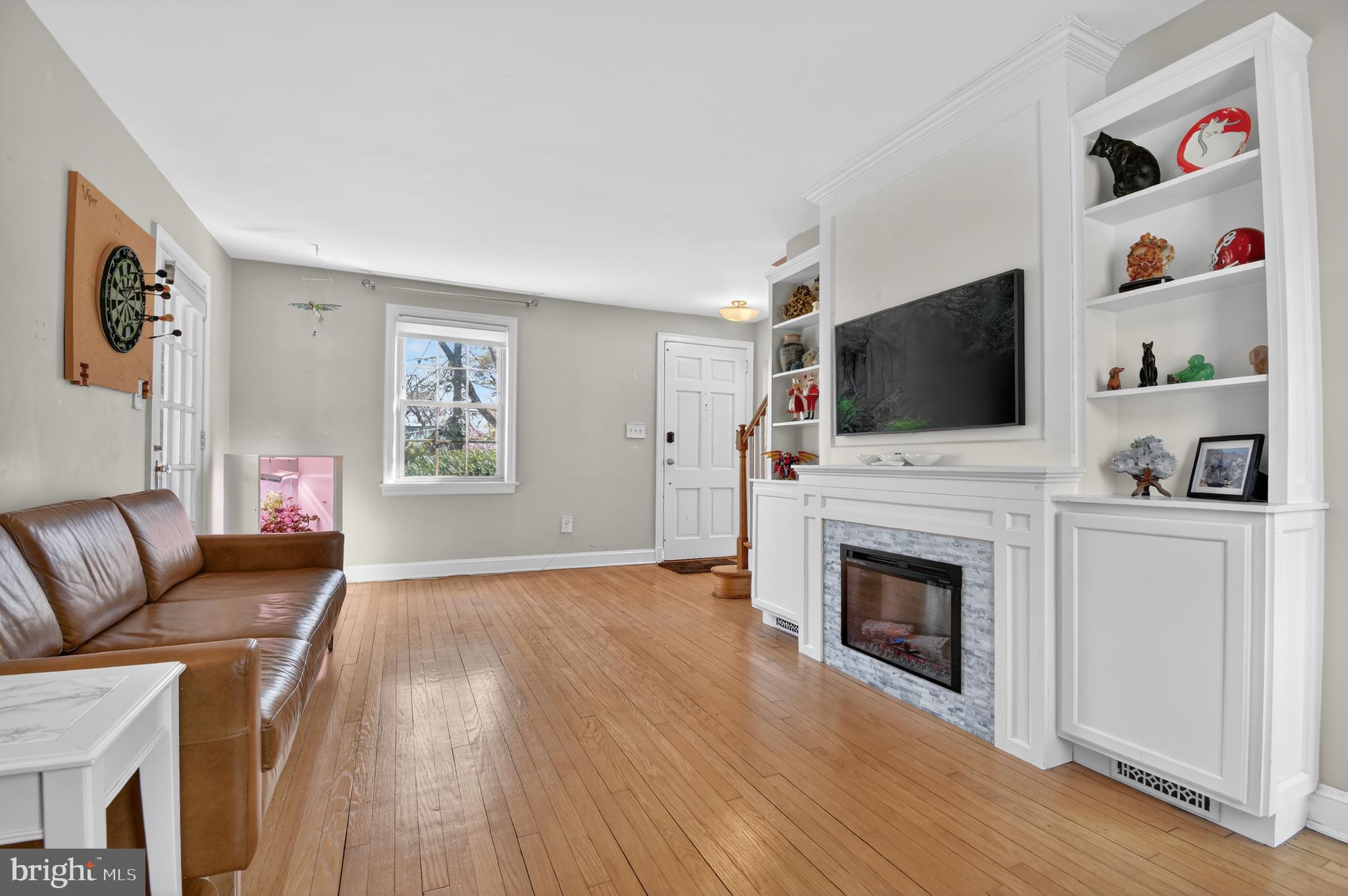 8306 Queen Annes Drive Silver Spring, MD 20910 - Photo 7 of 37 Electric fireplace, built-in shelving