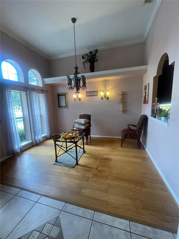 396 Kettering Road Deltona, FL 32725 - Photo 5 of 25 a view of a room with gym equipment