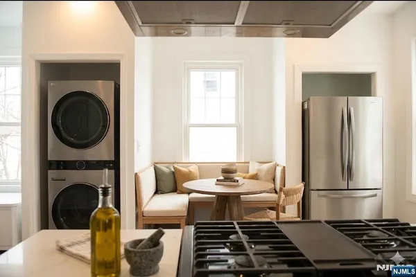 a view of a kitchen with washer and dryer