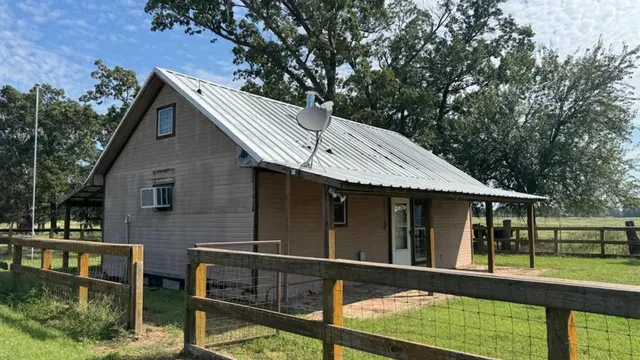 a view of a swimming pool and an outdoor seating
