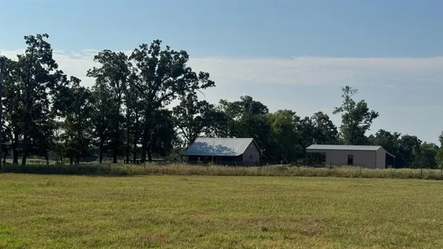a backyard of a house with lots of green space