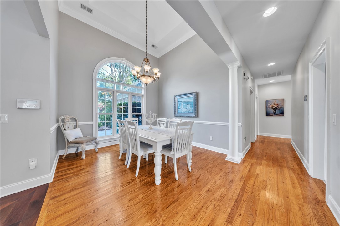 102 Country Walk Lane Clemson, SC 29631 - Photo 13 of 39 Elegant dining area with towering ceilings and gleaming hardwood floors.
