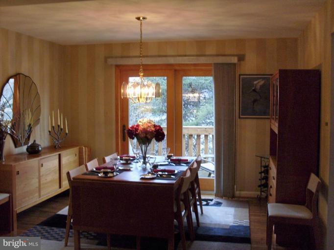 11082 Thrush Ridge Road Reston, VA 20191 - Photo 4 of 14 a view of a dining room with furniture and window