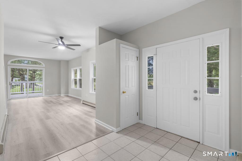 815 South Pine Creek Road Fairfield, CT 06824 - Photo 12 of 32 wooden floor in an empty room with a window