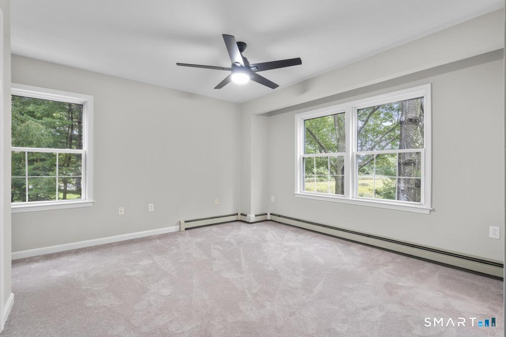 815 South Pine Creek Road Fairfield, CT 06824 - Photo 15 of 32 a view of an empty room with a window