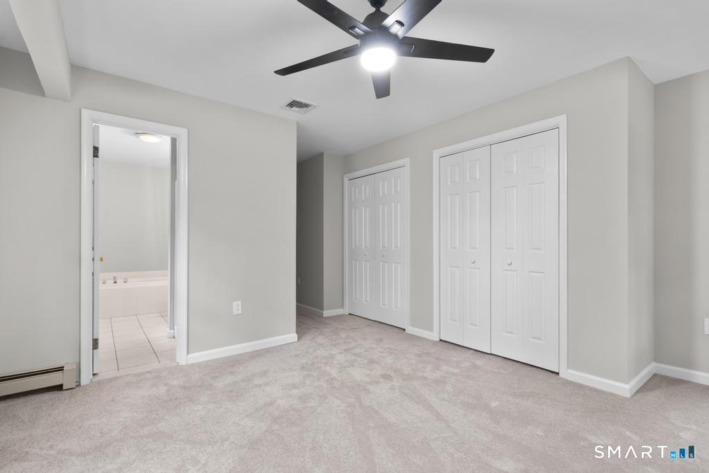 815 South Pine Creek Road Fairfield, CT 06824 - Photo 16 of 32 an empty room with closet and fan