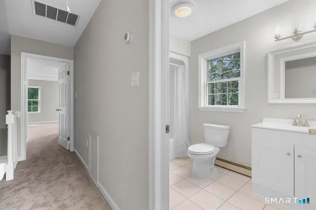 a bathroom with a toilet sink and a bathtub