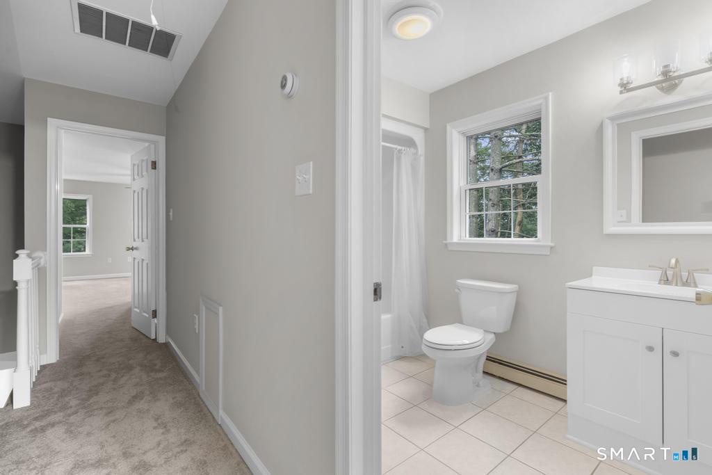 815 South Pine Creek Road Fairfield, CT 06824 - Photo 24 of 32 a bathroom with a toilet sink and a bathtub