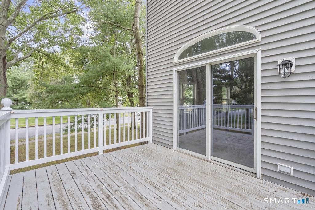 815 South Pine Creek Road Fairfield, CT 06824 - Photo 26 of 32 a view of backyard with deck and wooden floor
