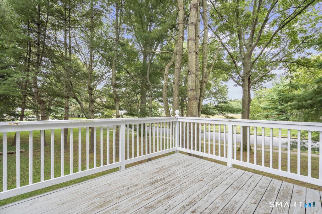 815 South Pine Creek Road Fairfield, CT 06824 - Photo 27 of 32 a view of balcony with wooden floor and fence