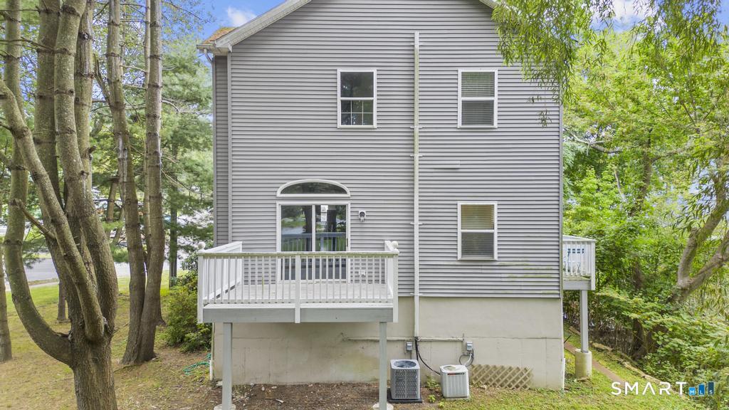 815 South Pine Creek Road Fairfield, CT 06824 - Photo 30 of 32 a front view of a house with a yard