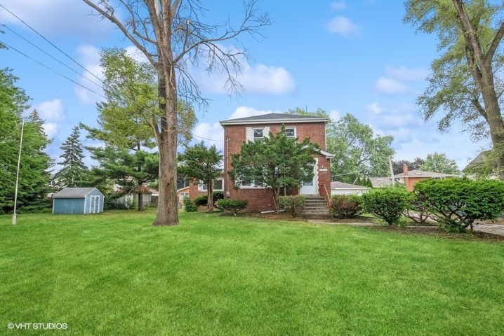 a view of a house with a backyard porch and sitting area