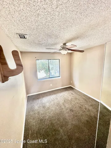 a view of a room with window and stairs