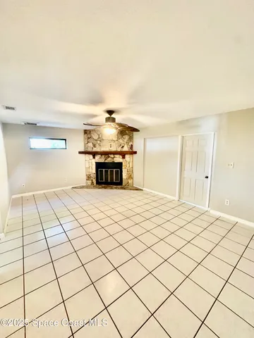 a bedroom with a bed and a night stand