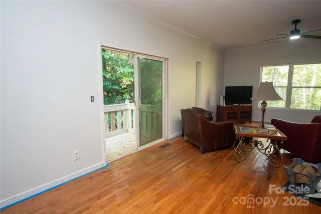 a living room with furniture fireplace and a flat screen tv