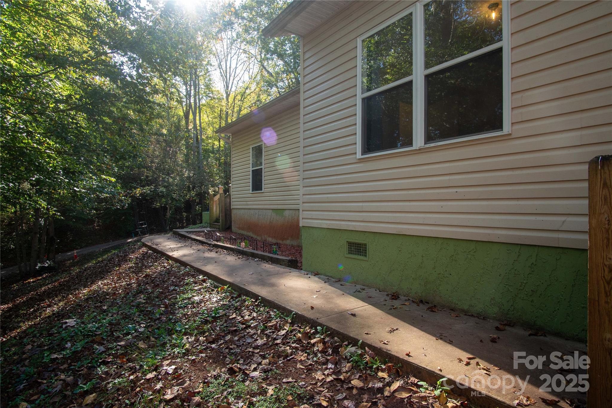 178 Levi Road Columbus, NC 28722 - Photo 2 of 36 a view of a backyard with a garden