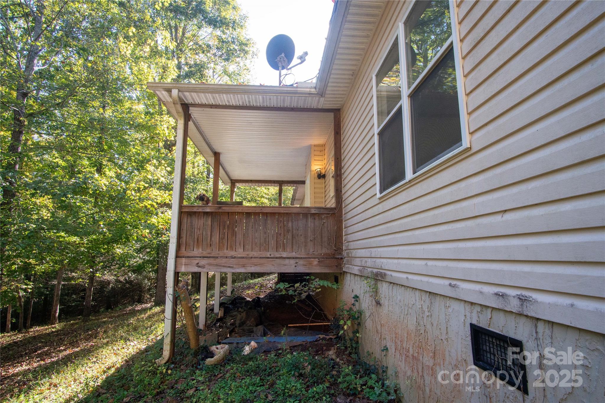 178 Levi Road Columbus, NC 28722 - Photo 6 of 36 a view of a patio with table and chairs with wooden floor and fence