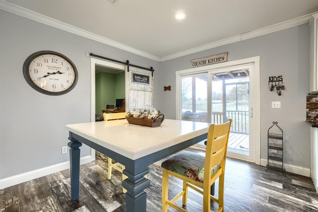 575 Highway 276 Point, TX 75472 - Photo 11 of 32 a view of a dining room with furniture window and wooden floor