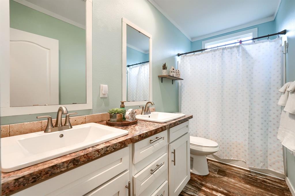 575 Highway 276 Point, TX 75472 - Photo 19 of 32 a bathroom with a granite countertop sink toilet and shower