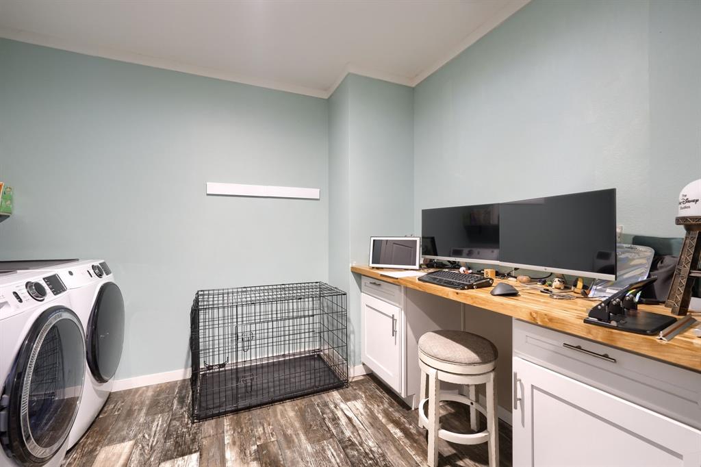 575 Highway 276 Point, TX 75472 - Photo 22 of 32 a view of a workspace with furniture and a flat screen tv