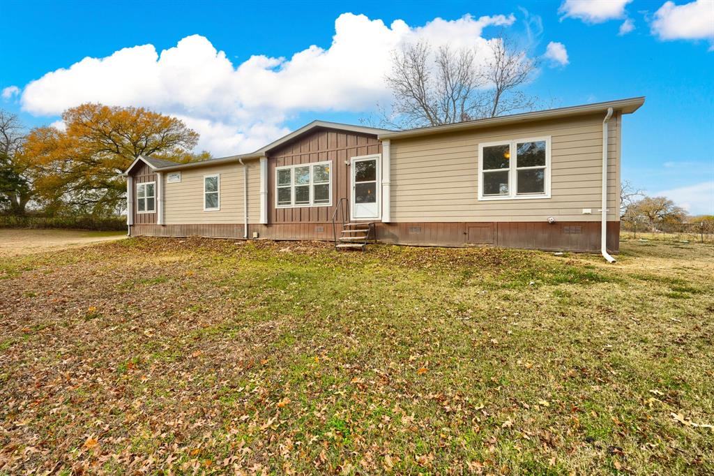 575 Highway 276 Point, TX 75472 - Photo 25 of 32 a view of a house with a yard