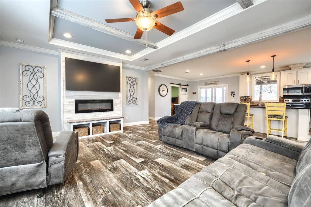 575 Highway 276 Point, TX 75472 - Photo 3 of 32 a living room with furniture and a flat screen tv