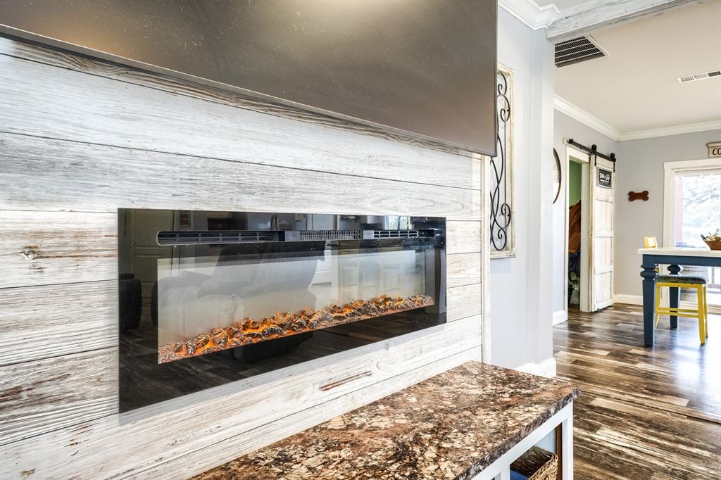 575 Highway 276 Point, TX 75472 - Photo 6 of 32 a living room with a fireplace