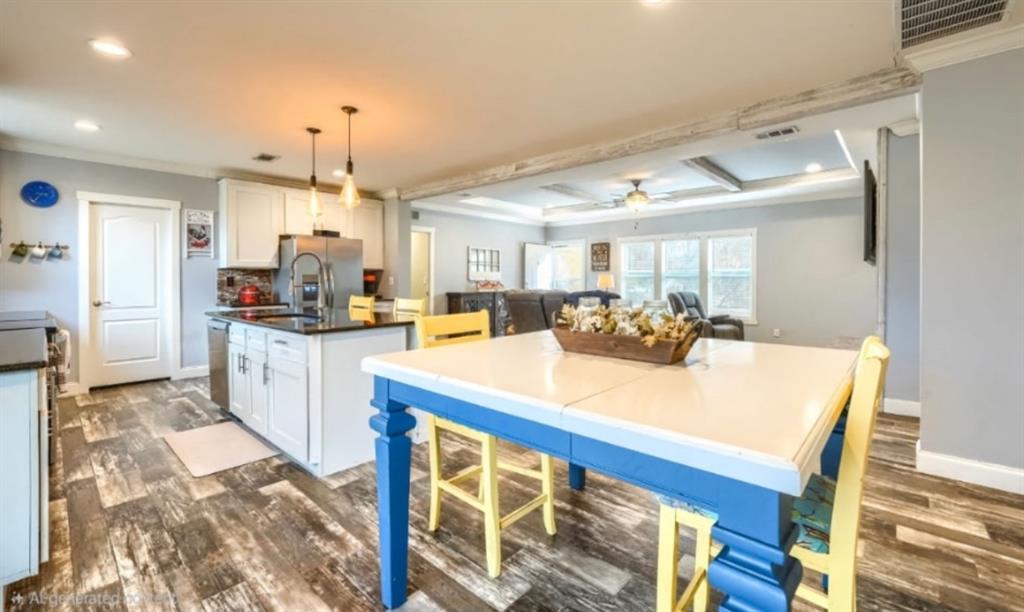 575 Highway 276 Point, TX 75472 - Photo 10 of 32 a open kitchen with stainless steel appliances kitchen island granite countertop a table chairs and a refrigerator