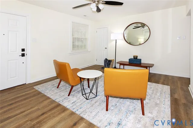 a living room with furniture and a rug